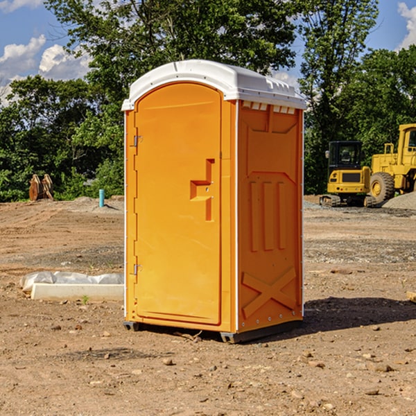 what is the cost difference between standard and deluxe portable restroom rentals in Buchanan